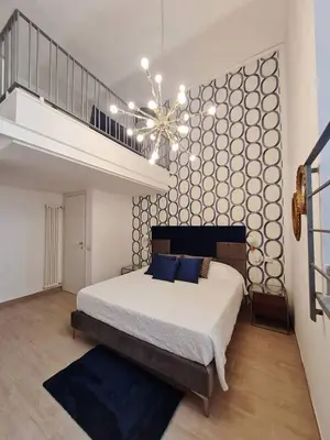 Letto o letti in una camera di Daymoon House Vanvitelli. Napoli