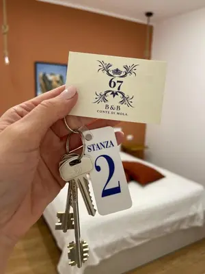 Letto o letti in una camera di Conte di Mola 67