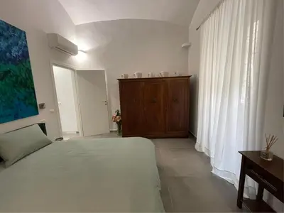 Letto o letti in una camera di Il fiore di Chiaia