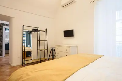 Letto o letti in una camera di A Casa di Ersi - Dimore Partenopee