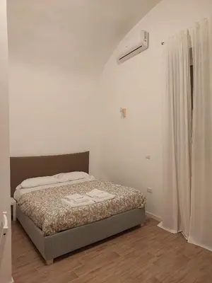 Letto o letti in una camera di Residence e appartamenti Bausan