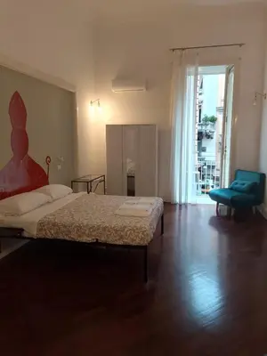 Letto o letti in una camera di Residence e appartamenti Cavallerizza