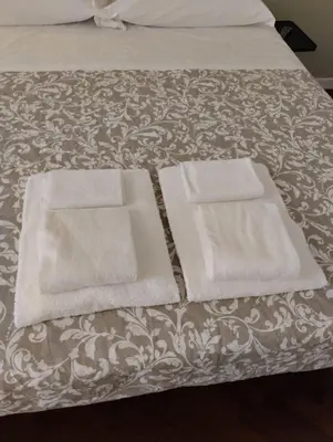 Letto o letti in una camera di Residence e appartamenti Cavallerizza