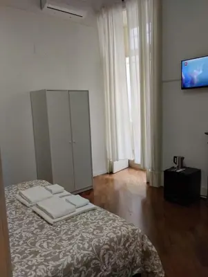 Letto o letti in una camera di Residence e appartamenti Cavallerizza