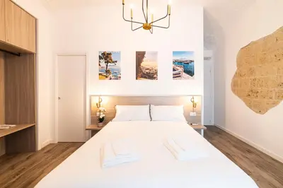 Letto o letti in una camera di Santa Teresa luxury rooms