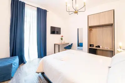 Letto o letti in una camera di Santa Teresa luxury rooms