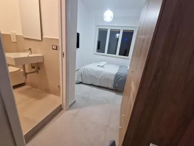 Letto o letti in una camera di Neapolitan Skyscraper Suites