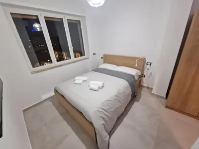 Letto o letti in una camera di Neapolitan Skyscraper Suites