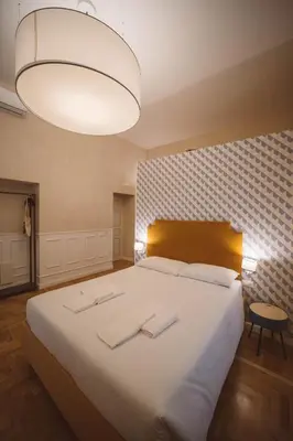 Letto o letti in una camera di Librai suite