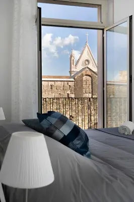 Letto o letti in una camera di Vista Duomo