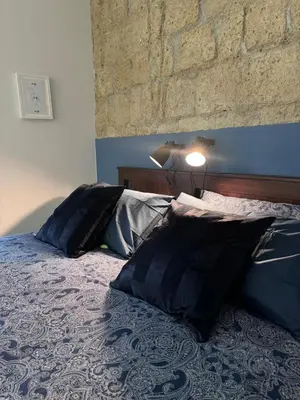 Letto o letti in una camera di Mirea Apartments - Napoli