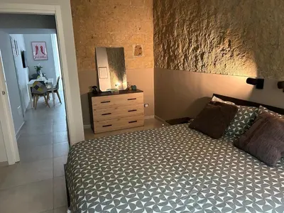 Letto o letti in una camera di Mirea Apartments - Napoli