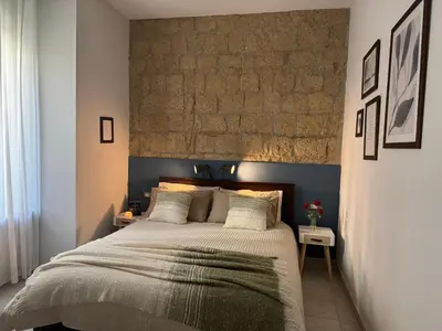 Letto o letti in una camera di Mirea Apartments - Napoli