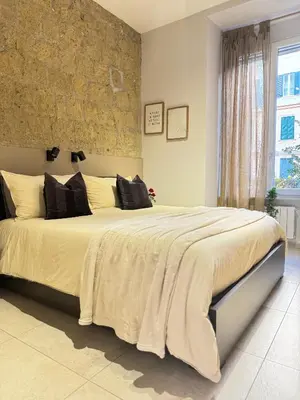 Letto o letti in una camera di Mirea Apartments - Napoli