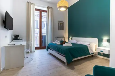 Letto o letti in una camera di RUA DE MAR CHIATAMONE