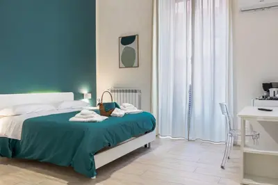 Letto o letti in una camera di RUA DE MAR CHIATAMONE
