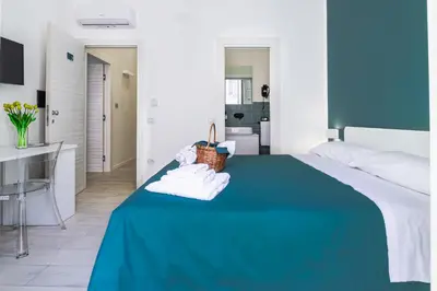 Letto o letti in una camera di RUA DE MAR CHIATAMONE