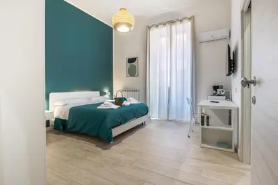 Letto o letti in una camera di RUA DE MAR CHIATAMONE