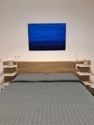 Letto o letti in una camera di Riviera Apartment Napoli
