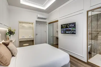 Letto o letti in una camera di ATAROOMS Suites Napoli