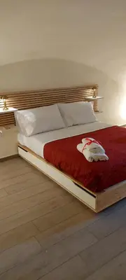 Letto o letti in una camera di Domus Dante al balconcino