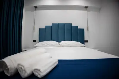 Letto o letti in una camera di FP Suite