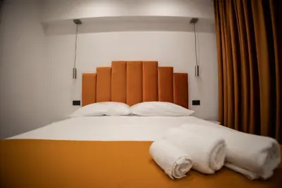 Letto o letti in una camera di FP Suite