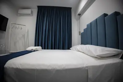 Letto o letti in una camera di FP Suite