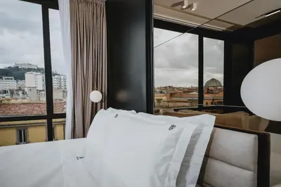 Letto o letti in una camera di POETICA BOUTIQUE SKY HOTEL