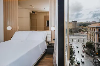 Letto o letti in una camera di POETICA BOUTIQUE SKY HOTEL