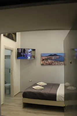 Letto o letti in una camera di Casa We Love Napoli