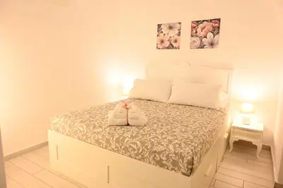 Letto o letti in una camera di Chiaia Chic House