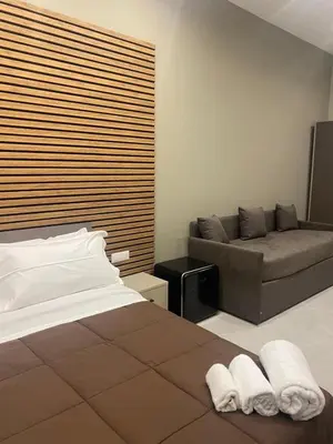 Letto o letti in una camera di DIMORA DEL PLEBISCITO B&b