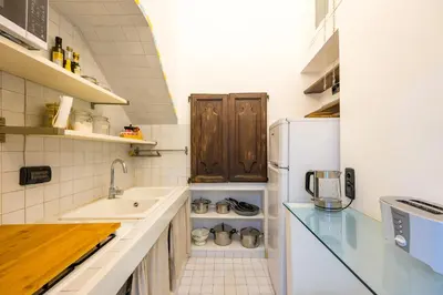 Cucina o angolo cottura di Hidden Gem on Chiaia pedastrian area by Napoliapartments