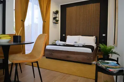 Letto o letti in una camera di BlackWoody Contemporary Rooms - Napoli Centro Storico