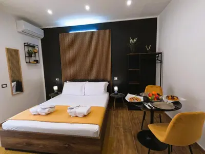 Letto o letti in una camera di BlackWoody Contemporary Rooms - Napoli Centro Storico