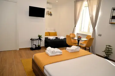 Letto o letti in una camera di BlackWoody Contemporary Rooms - Napoli Centro Storico