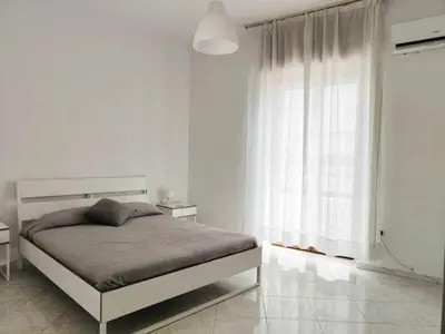 Letto o letti in una camera di Napoli Felix Casa Baby e Pet Friendly