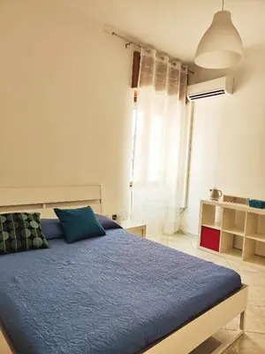 Letto o letti in una camera di Napoli Felix Casa Baby e Pet Friendly