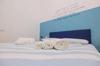 Letto o letti in una camera di Le Stanze Del Poeta Libero Bovio