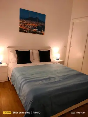 Letto o letti in una camera di Le Follie Parthenopee