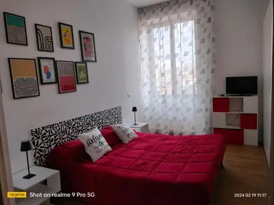 Letto o letti in una camera di Le Follie Parthenopee