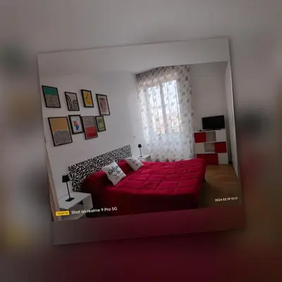 Letto o letti in una camera di Le Follie Parthenopee