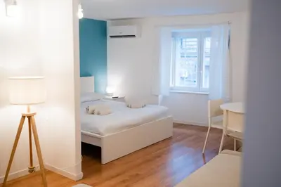 Letto o letti in una camera di Casetta Vacanze Partenope