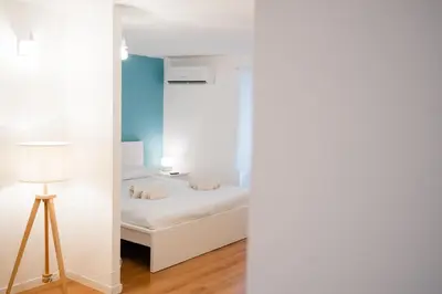 Letto o letti in una camera di Casetta Vacanze Partenope