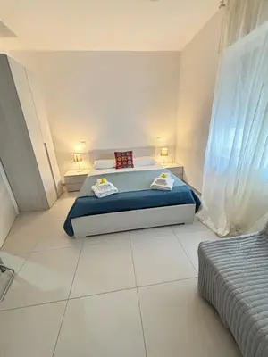 Letto o letti in una camera di DIEGO HOUSE DUOMO Costa
