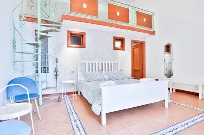 Letto o letti in una camera di GuestHost - Chiaia Sea View Gem