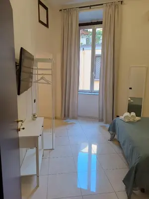 Letto o letti in una camera di Residenza GeRi - Suite and Home Napoli Centro