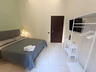 Letto o letti in una camera di Residenza GeRi - Suite and Home Napoli Centro