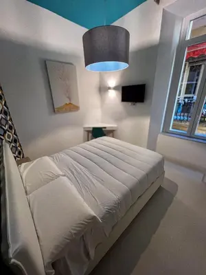 Letto o letti in una camera di Bed & Breakfast SpaccaNapoli 56